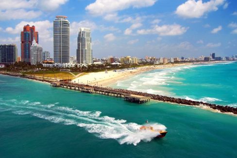 Aerial_view_of_South_Miami_Beach_with_Pilot_boat_sailing_next_to_the_city_line_terrenosnaflorida-com_shutterstock_224565427_1200x680