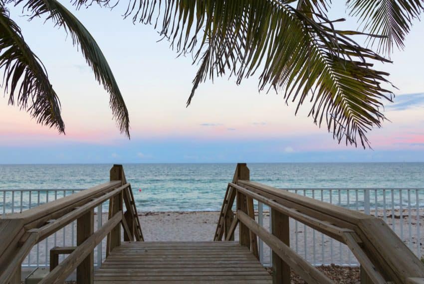 Wooden_stairs_on_deserted_beach_dunes_in_Vero_Beach_Florida_terrenosnaflorida-com_shutterstock_497119957_1200x680